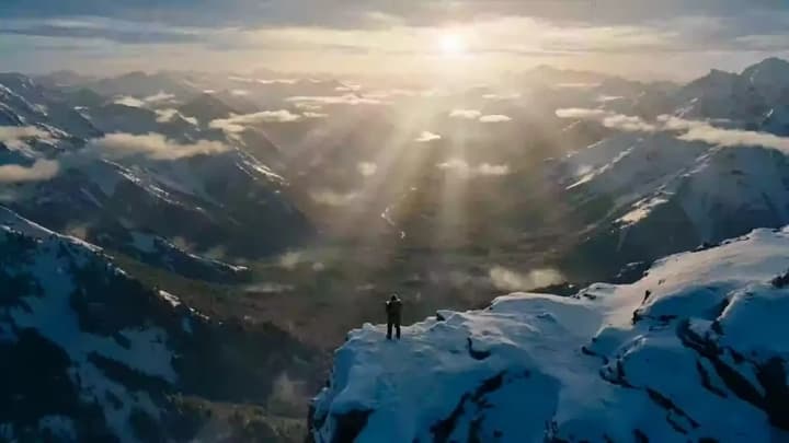 Summiting a snow-capped mountain